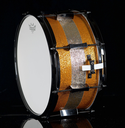 PORK_PIE_PERCUSSION_7_X_13_SNARE_DRUM_IN_ORANGE_SPARKLE_AND_CHAMPAGNE_SPARKLE_STRIPE_W_BLACK_HARDWARE-68d1ffba2c9f2.webp