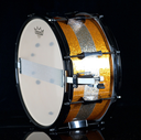 PORK_PIE_PERCUSSION_7_X_13_SNARE_DRUM_IN_ORANGE_SPARKLE_AND_CHAMPAGNE_SPARKLE_STRIPE_W_BLACK_HARDWARE-68d1ffbad59bc.webp